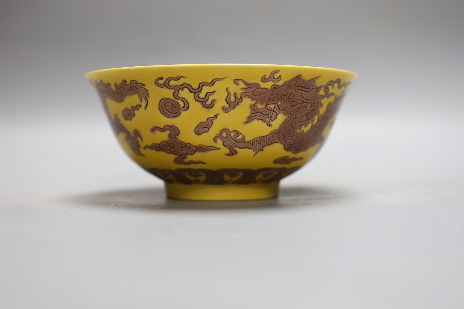 A Chinese yellow ground 'dragon' bowl, 15cm diameter